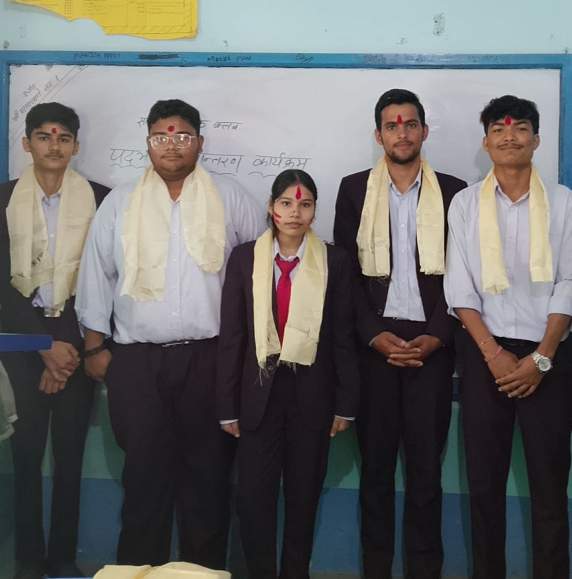 A group of diverse students collaborating on a project in a modern, well-lit room.